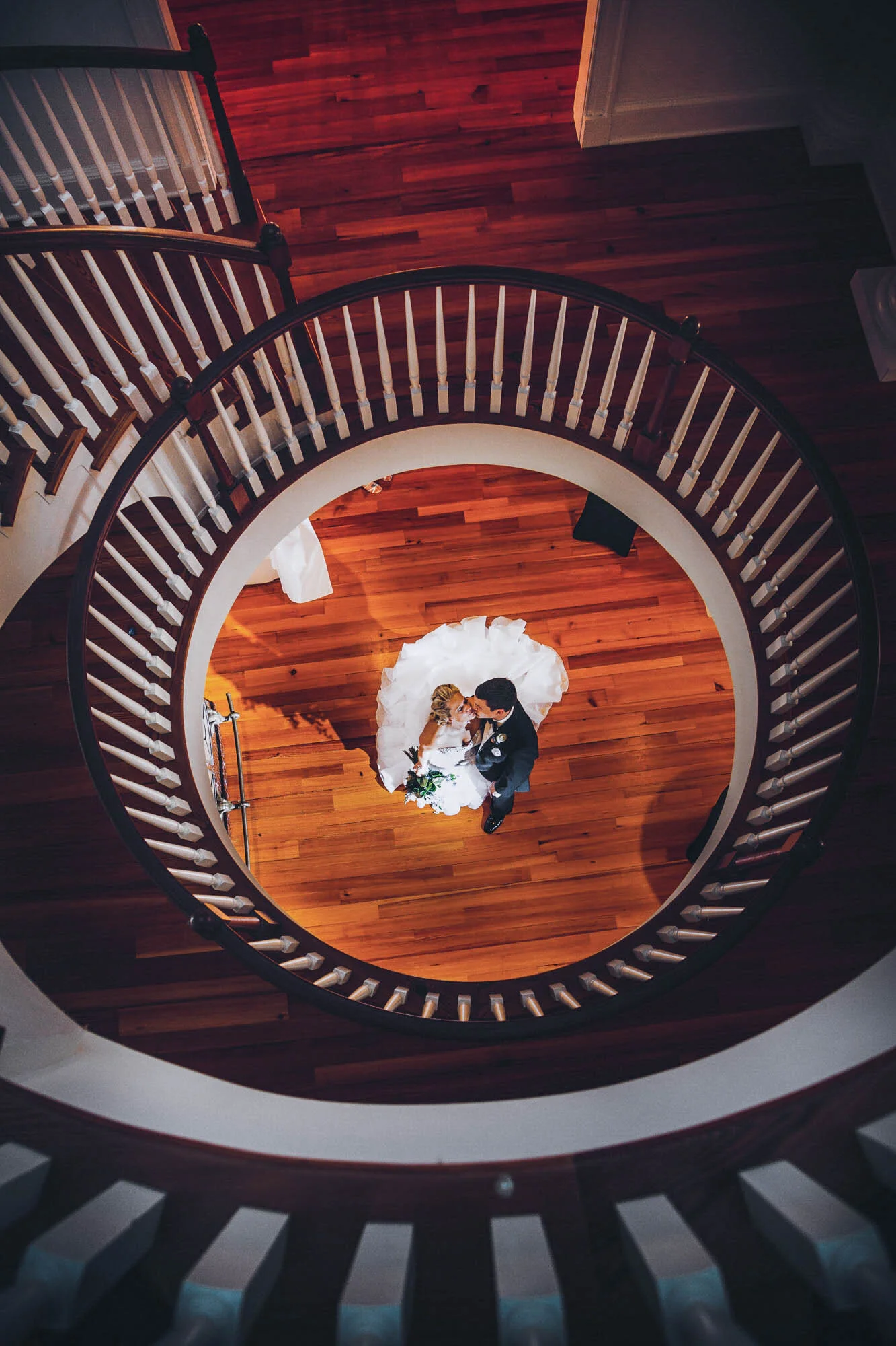 bride and groom on sprial staircase.jpg