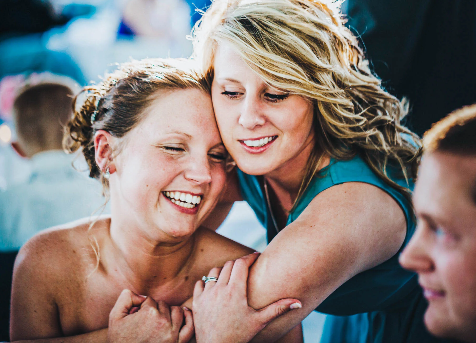 bride hugging bridesmaid.jpg