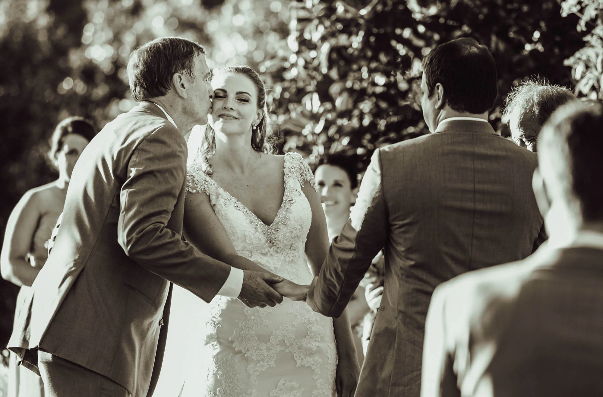 father kissing bride.jpg