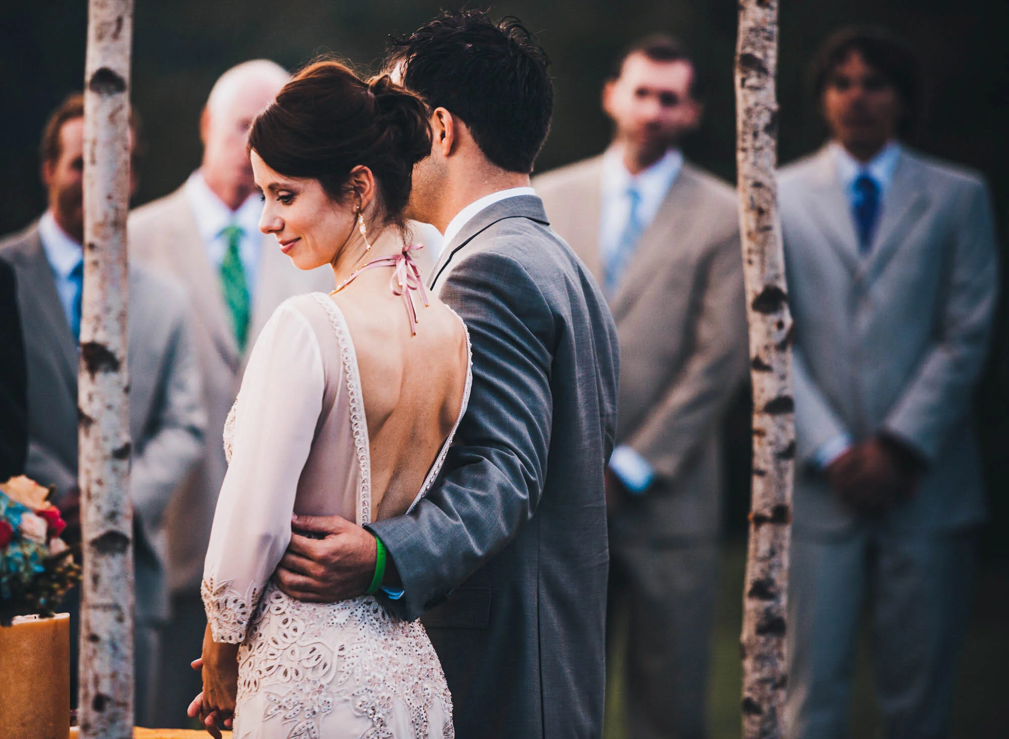 groom holding bride at ceremony.jpg