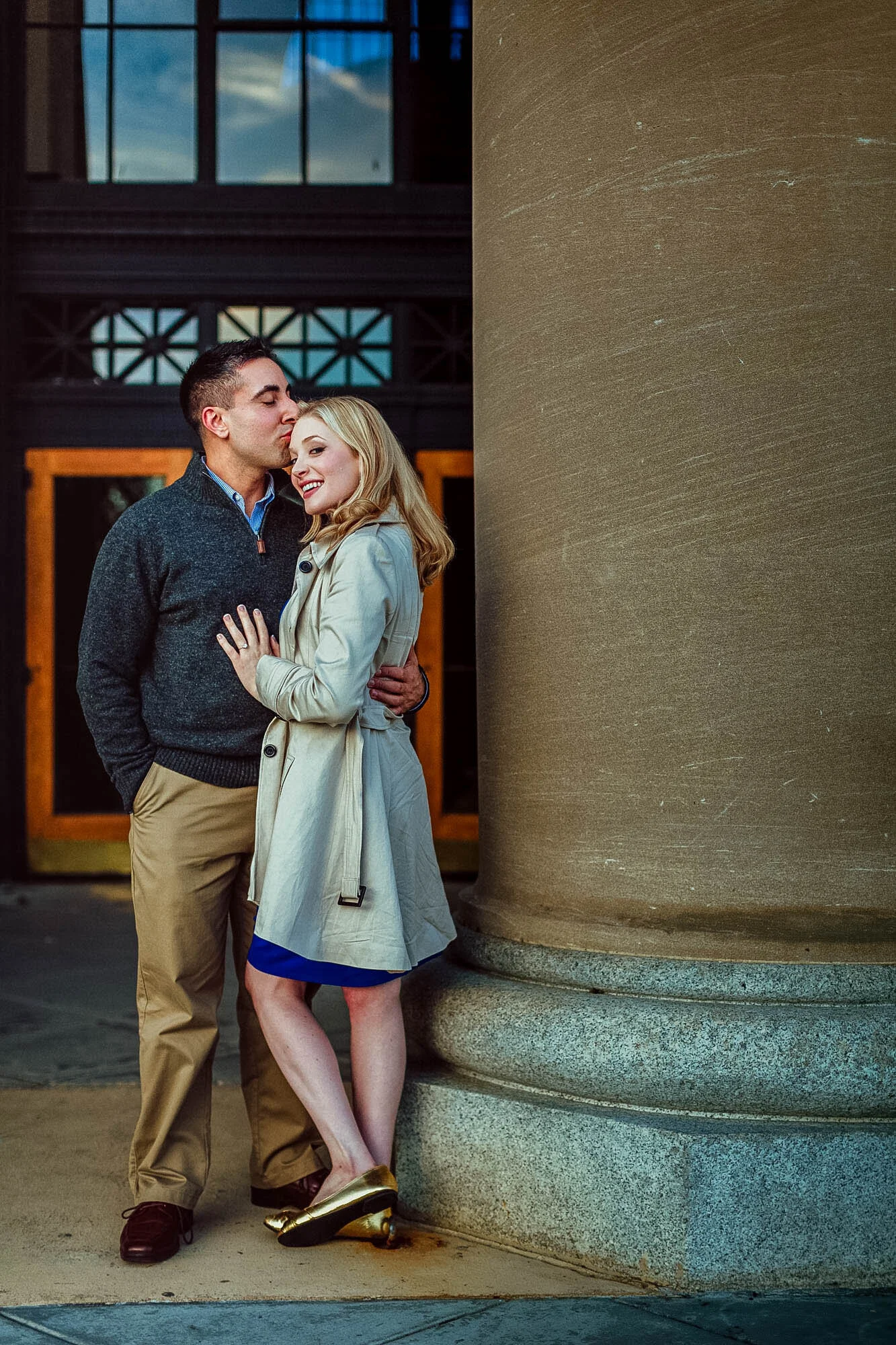 couple hugging next to column.jpg