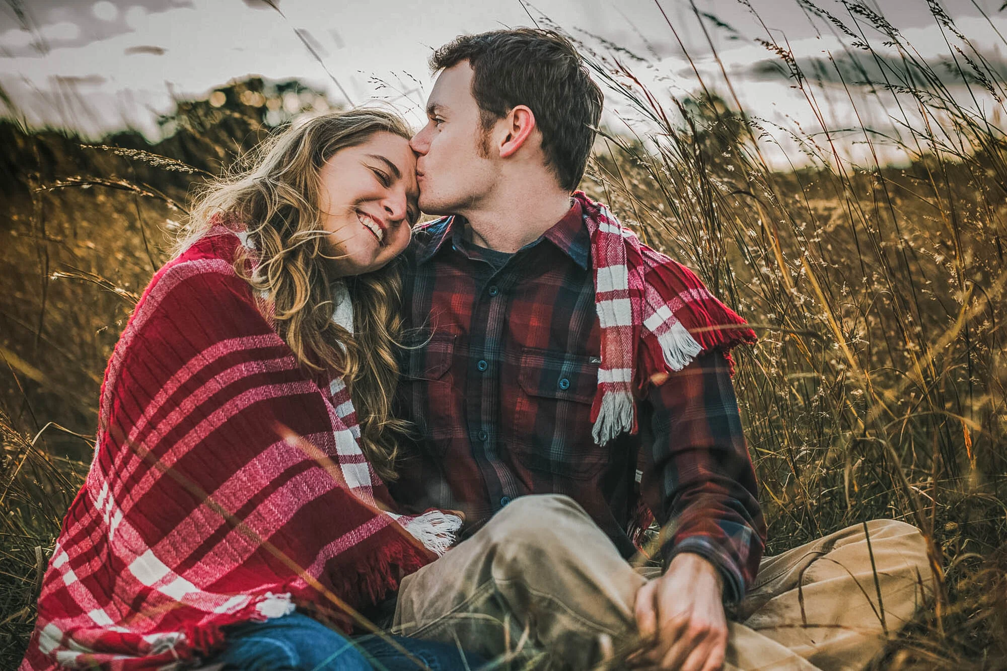 couple kissing in grass.jpg