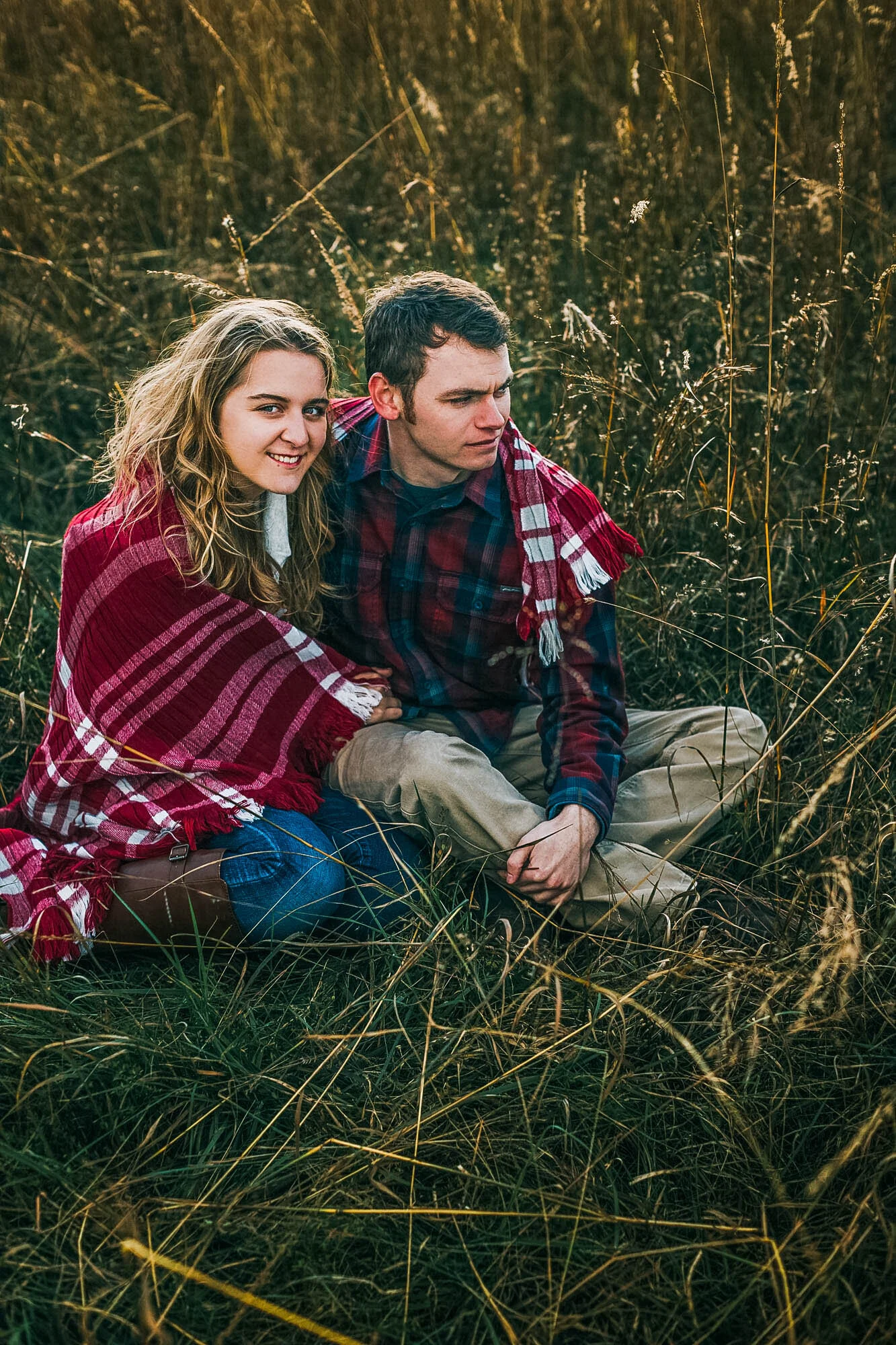 couple seated in tall grass.jpg