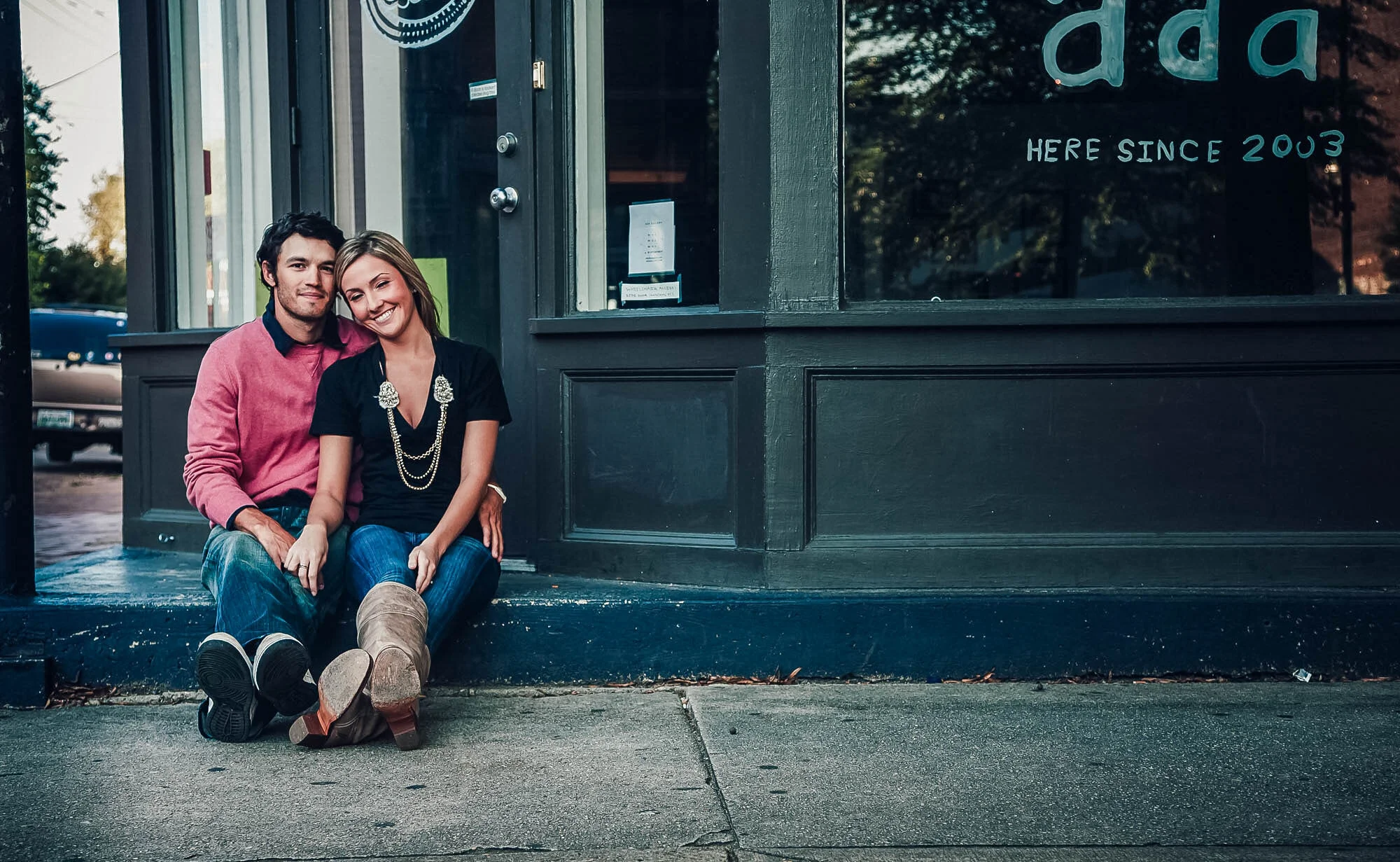 couple seated on shop step.jpg