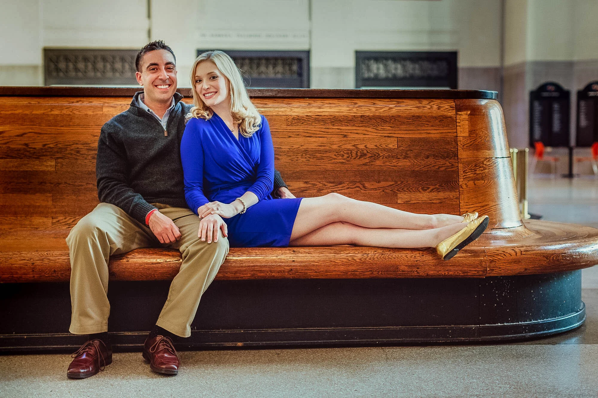couple seated on train station bench.jpg