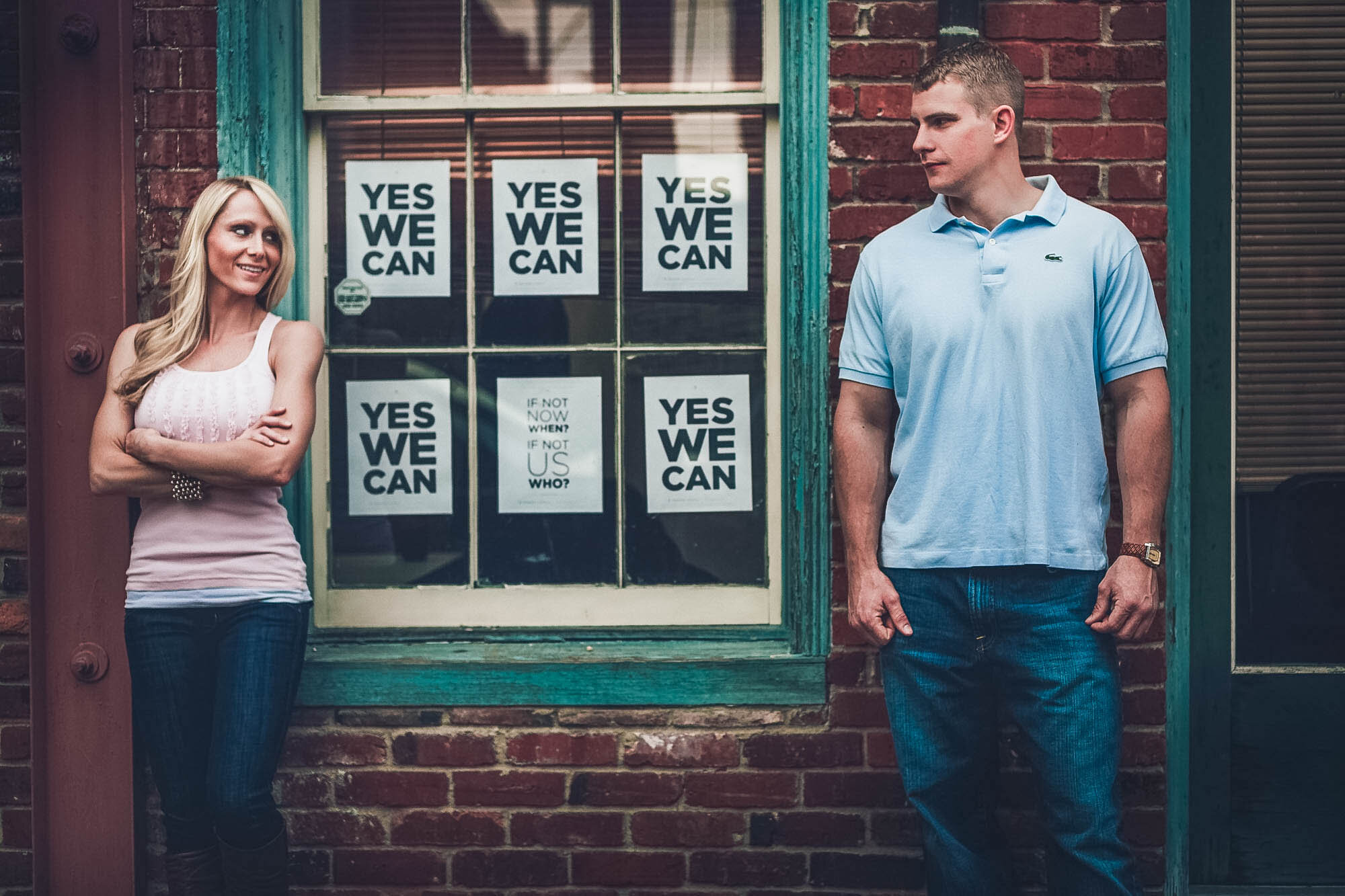 couple standign before window signs.jpg