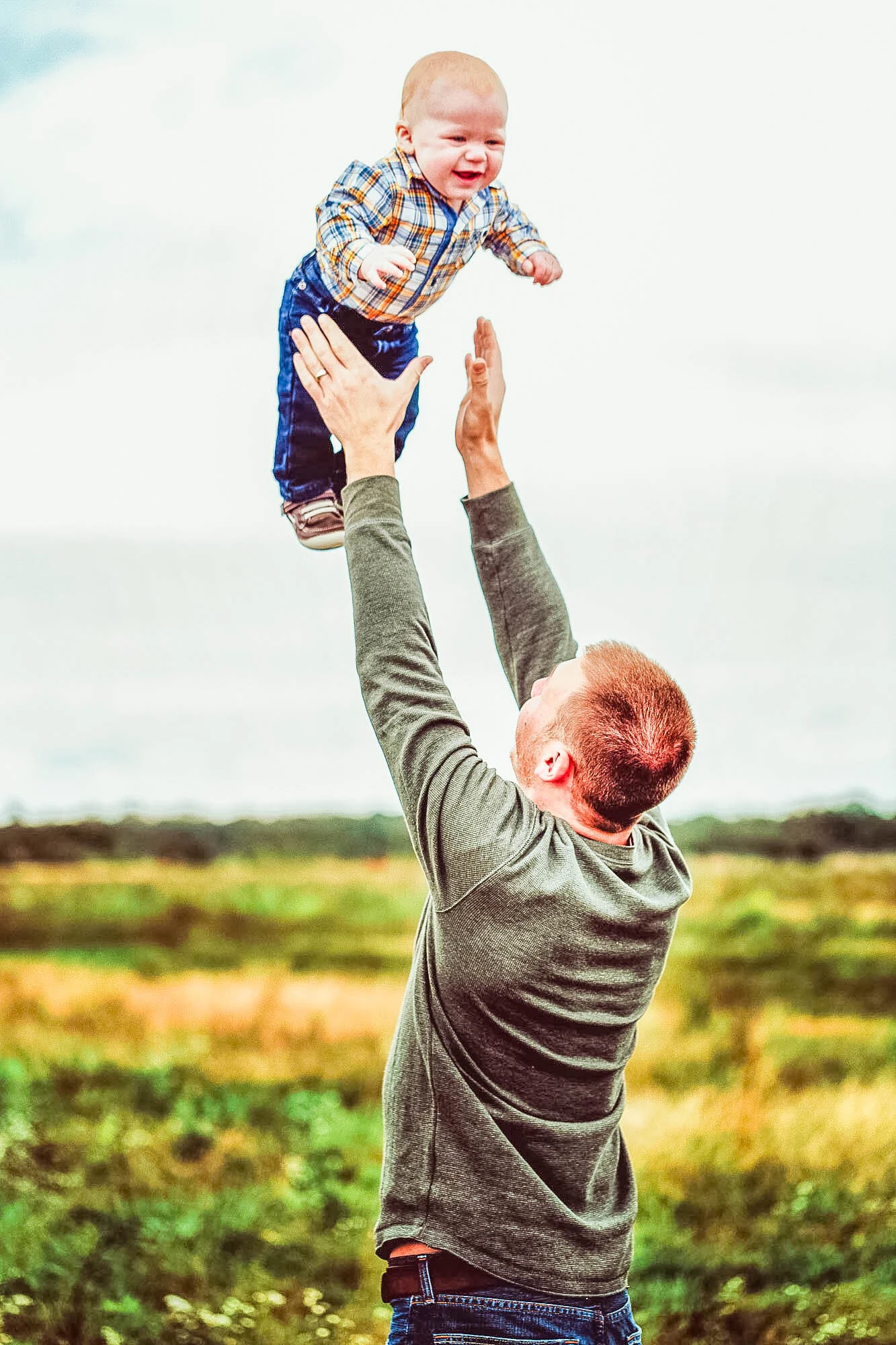 father throwing baby.jpg