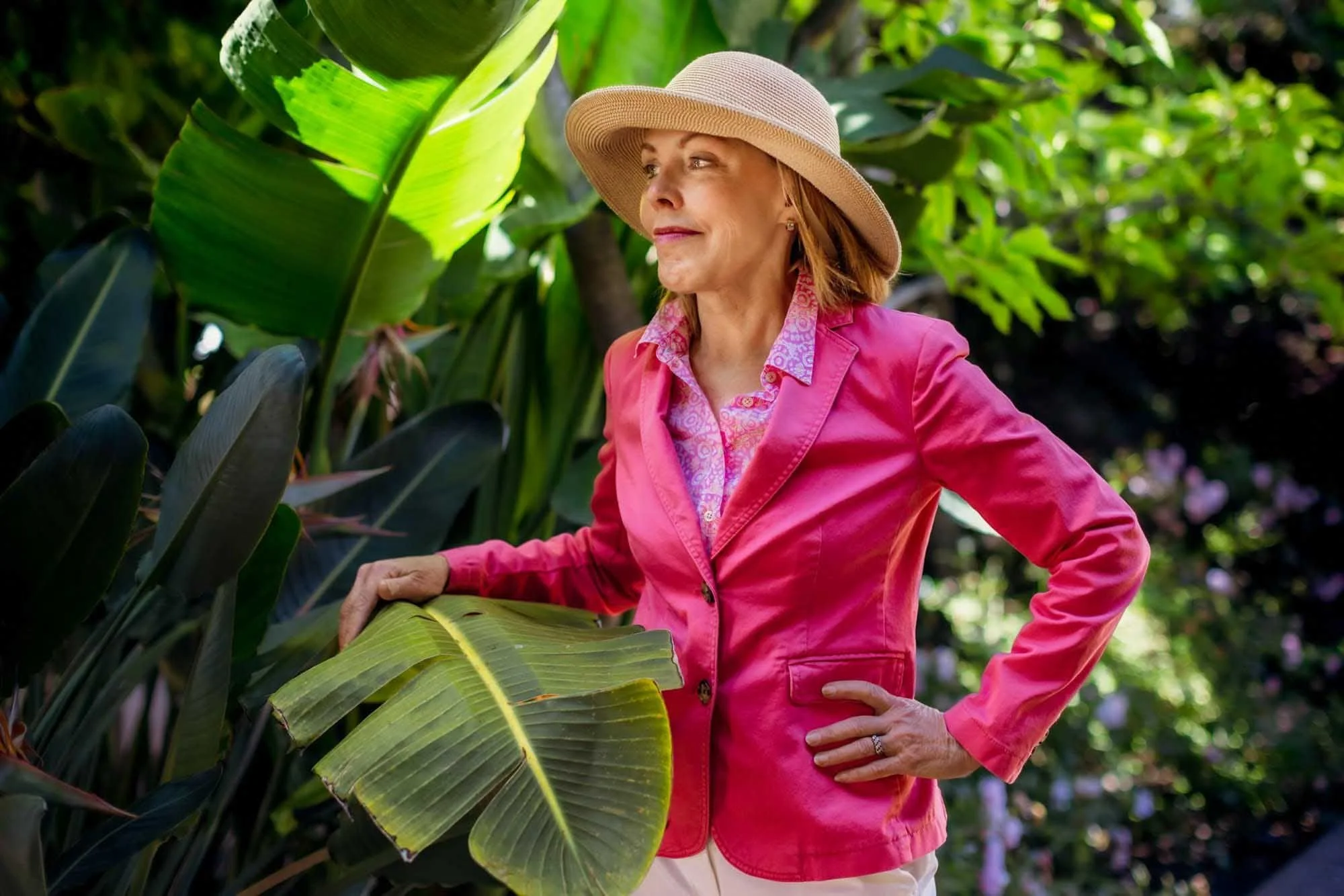 Entrepreneur in a blazer posing in a modern workspace for a brand photoshoot