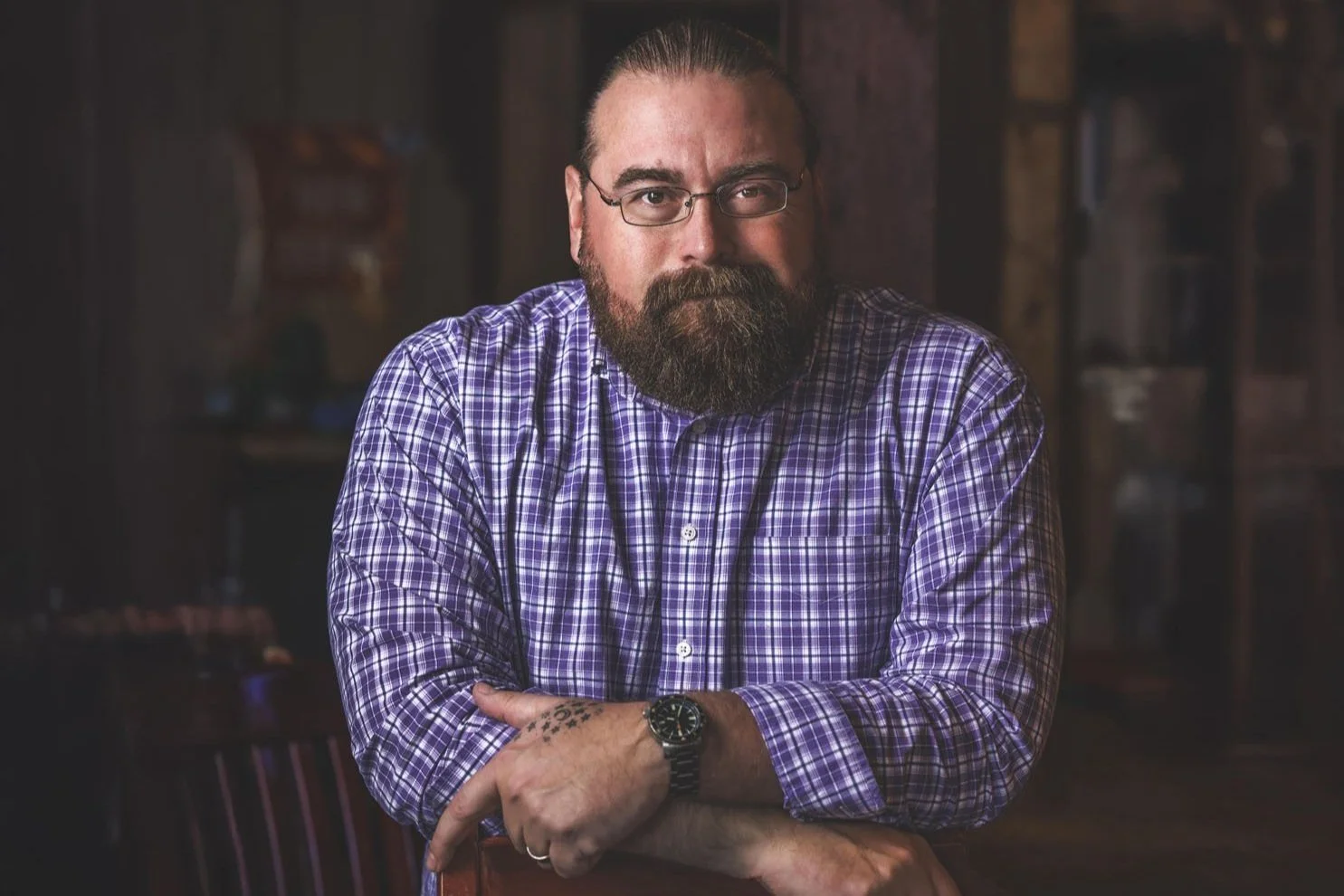 Portrait of smiling bearded man in glasses