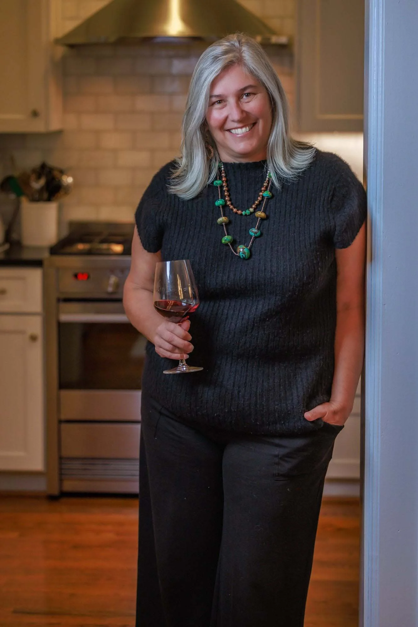 Lifestyle portrait of a business owner in a home kitchen setting