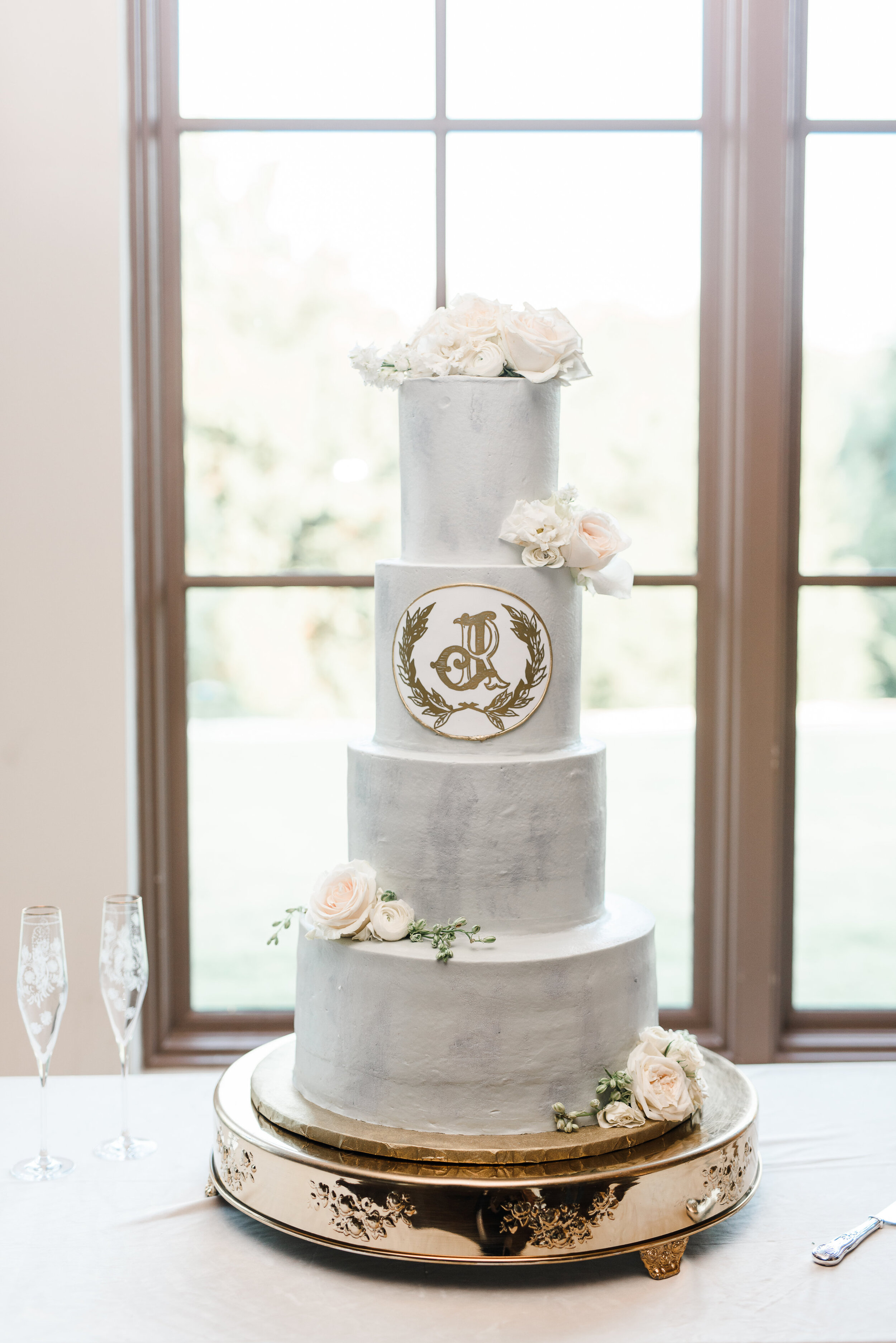 custom gold monogram wedding cake - pink champagne paper