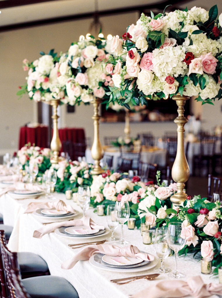 head table floral design with paper from pink champagne designs .jpg