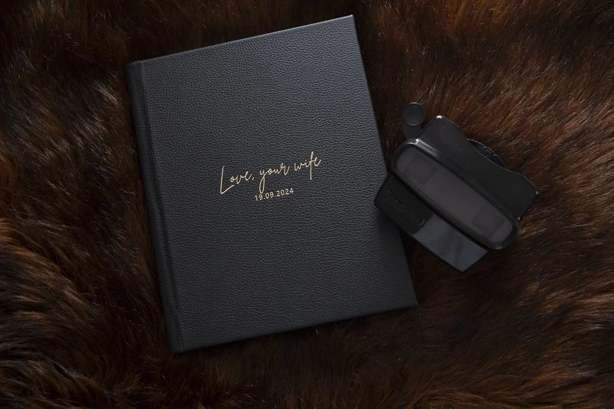 black leather boudoir album with retro viewfinder