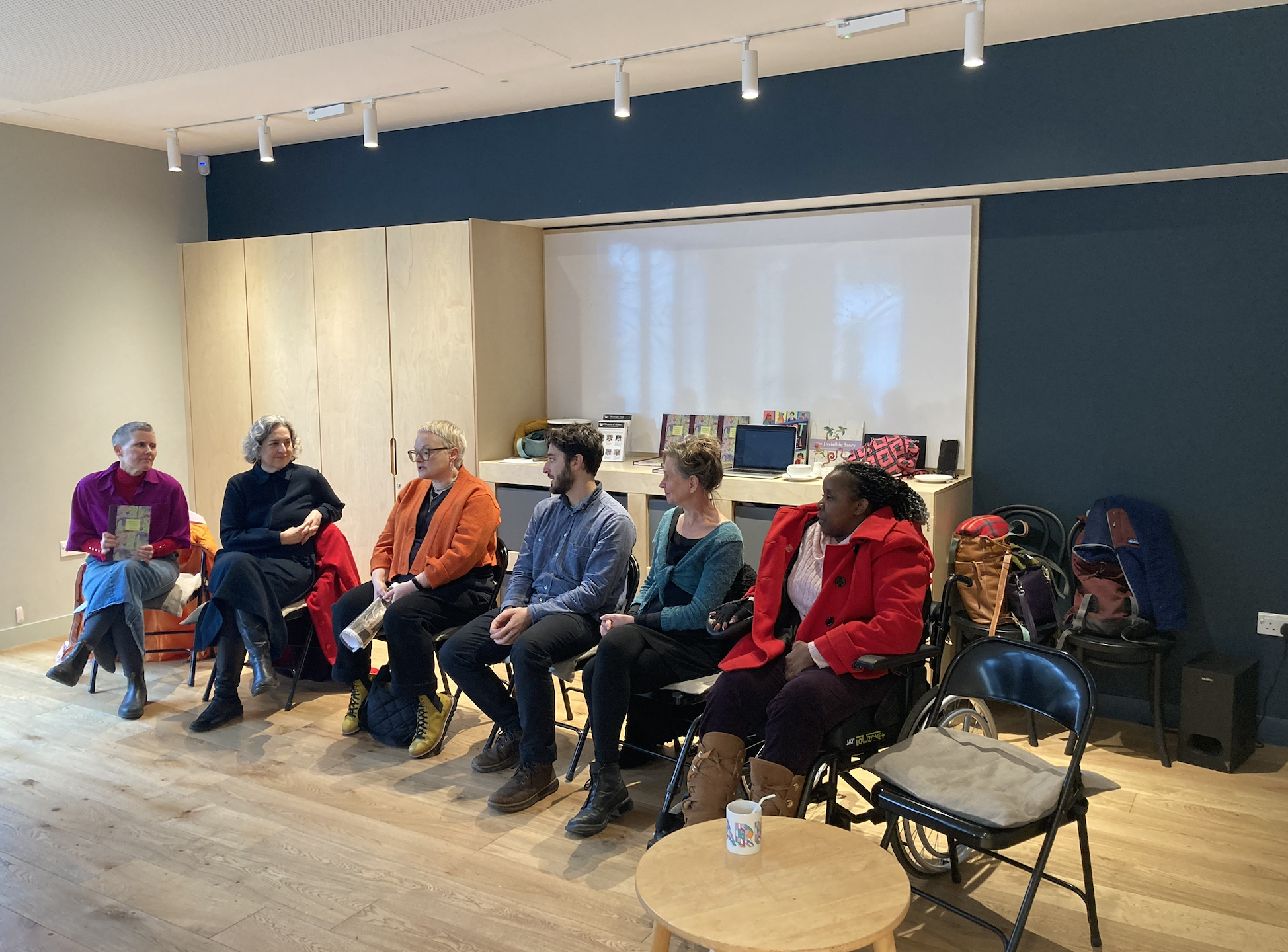 Photo of a panel of people seated in the Harriet Delph Room. The panel is the production team plus the Mayor of Hackney