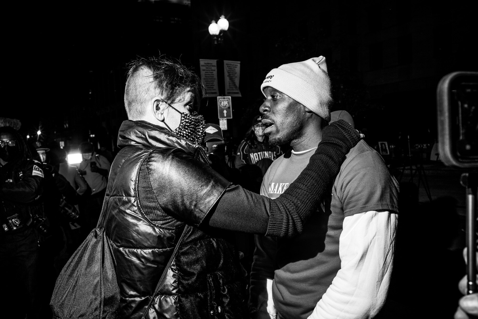  BLM Protestor talks with a Trump Supporter at Black Lives Matter Plaza in Washington, DC. 