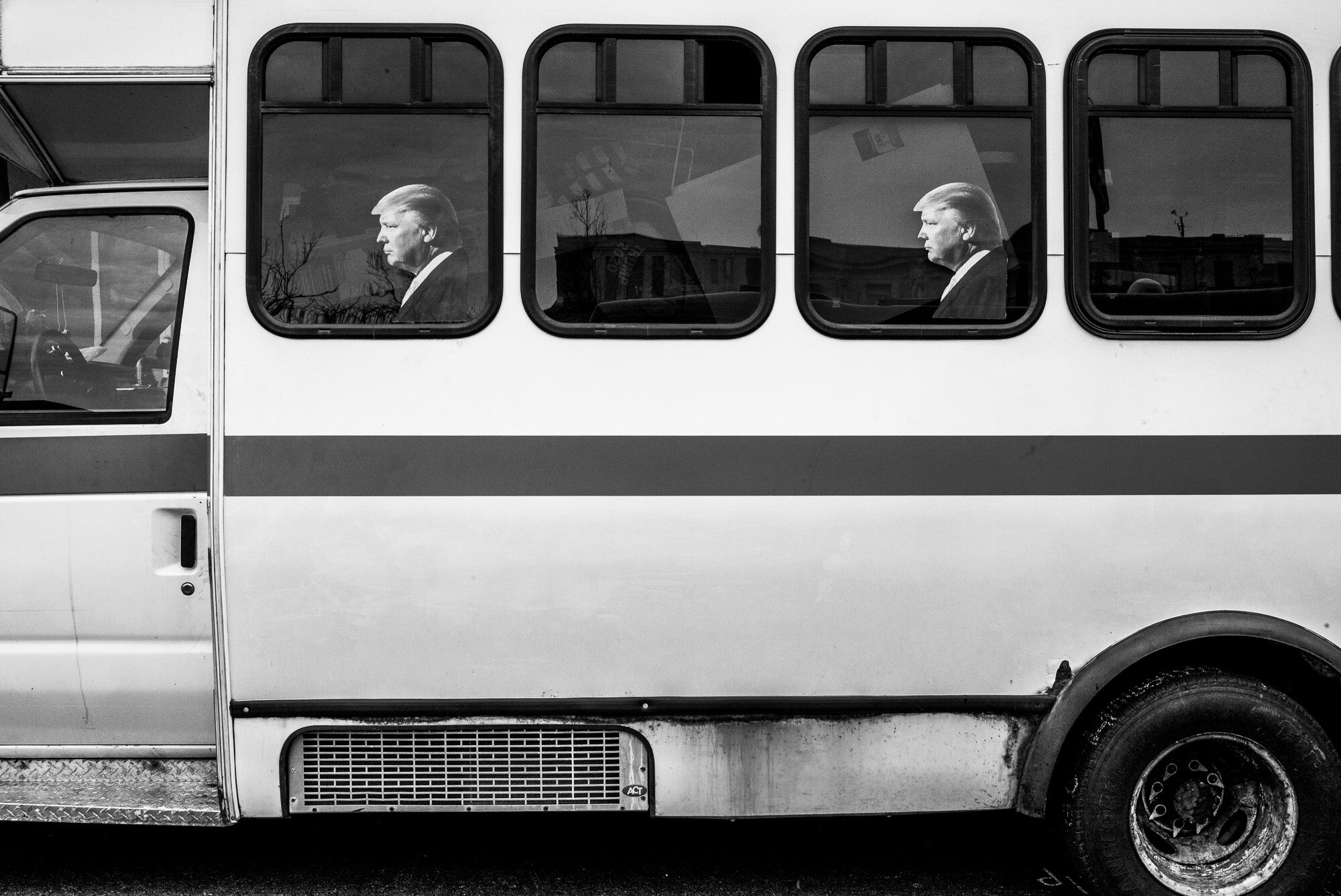  Short bus with Donald Trump cut-outs. 