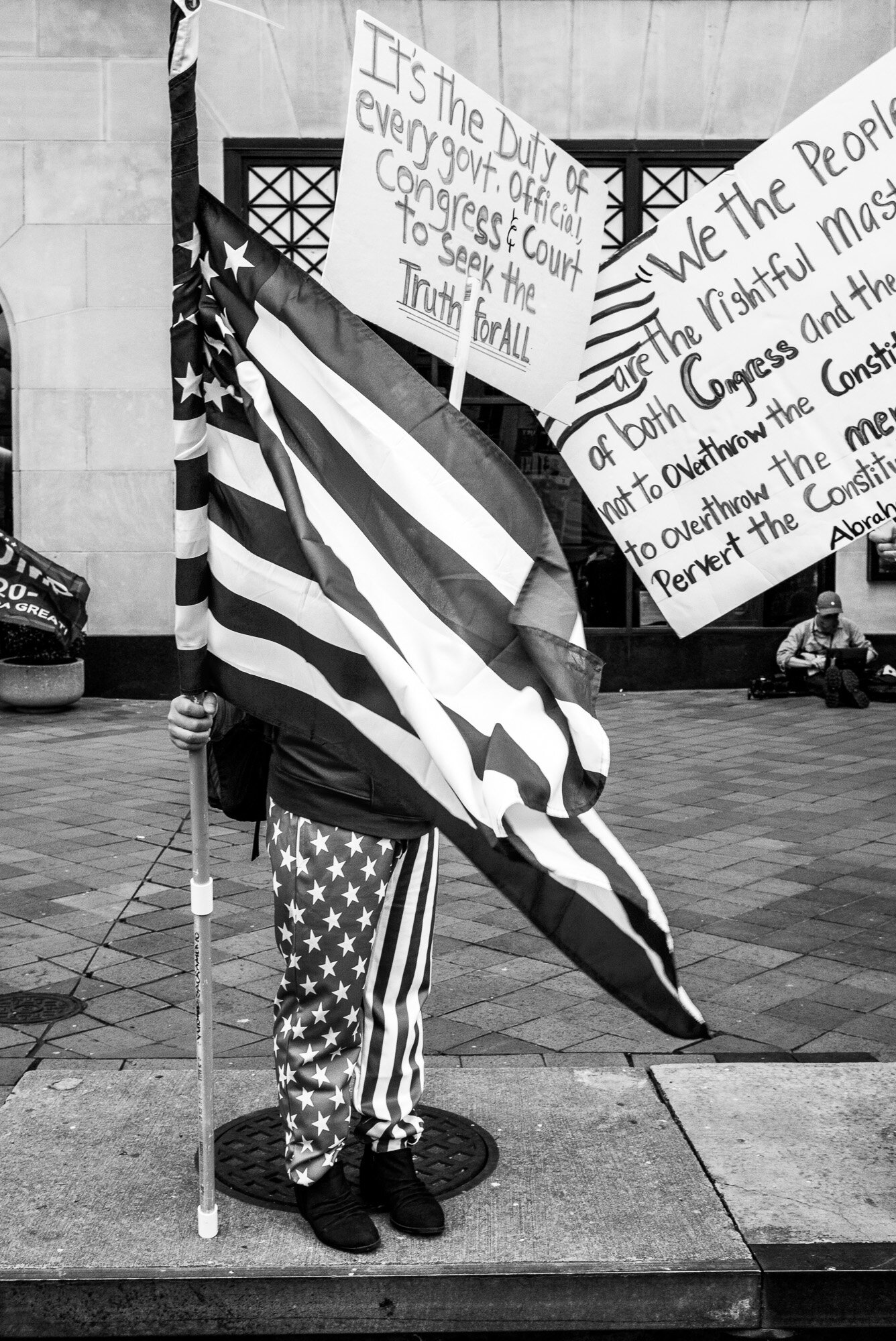  Person with American flag at the Dec 12 Stop the Steal rally at freedom Plaza in DC. 