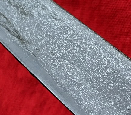 A recently etched and oiled pesh kabz blade.