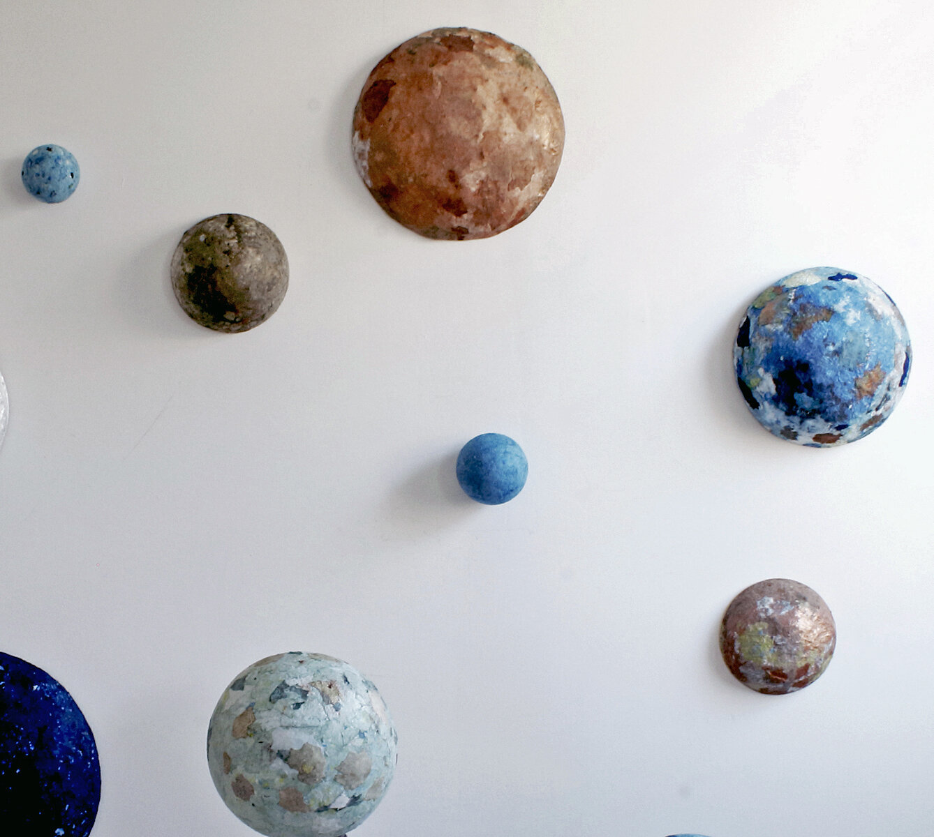  Possible Planets (detail), H 72”, W 72”, D 46.5”, artist cast and pigmented Abaca/cotton and wood, 2021 