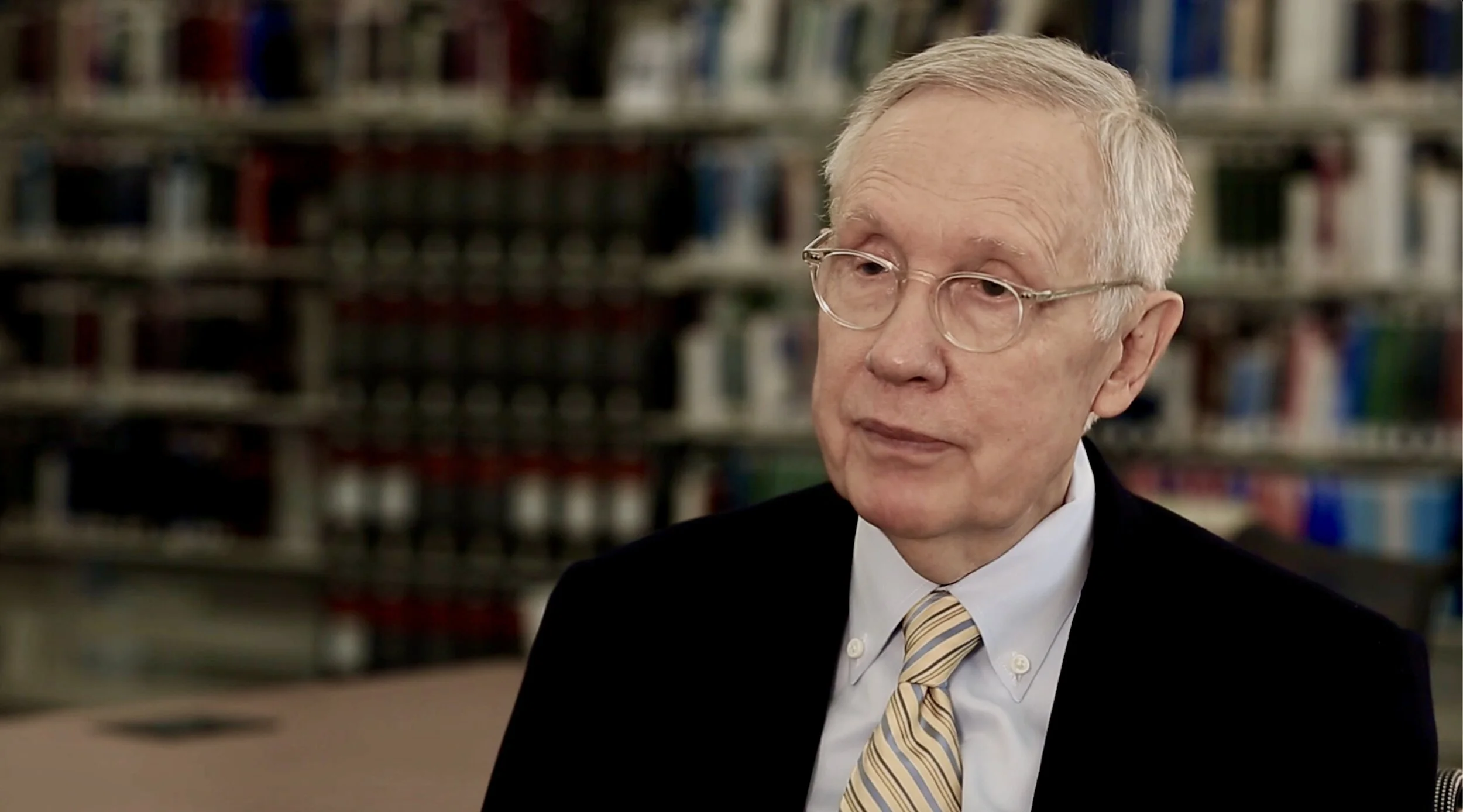 Former Senate Majority Leader Harry Reid is among the many interviewees.