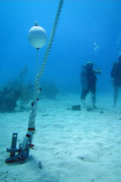 A newly installed mooring line on a Helix sand anchor