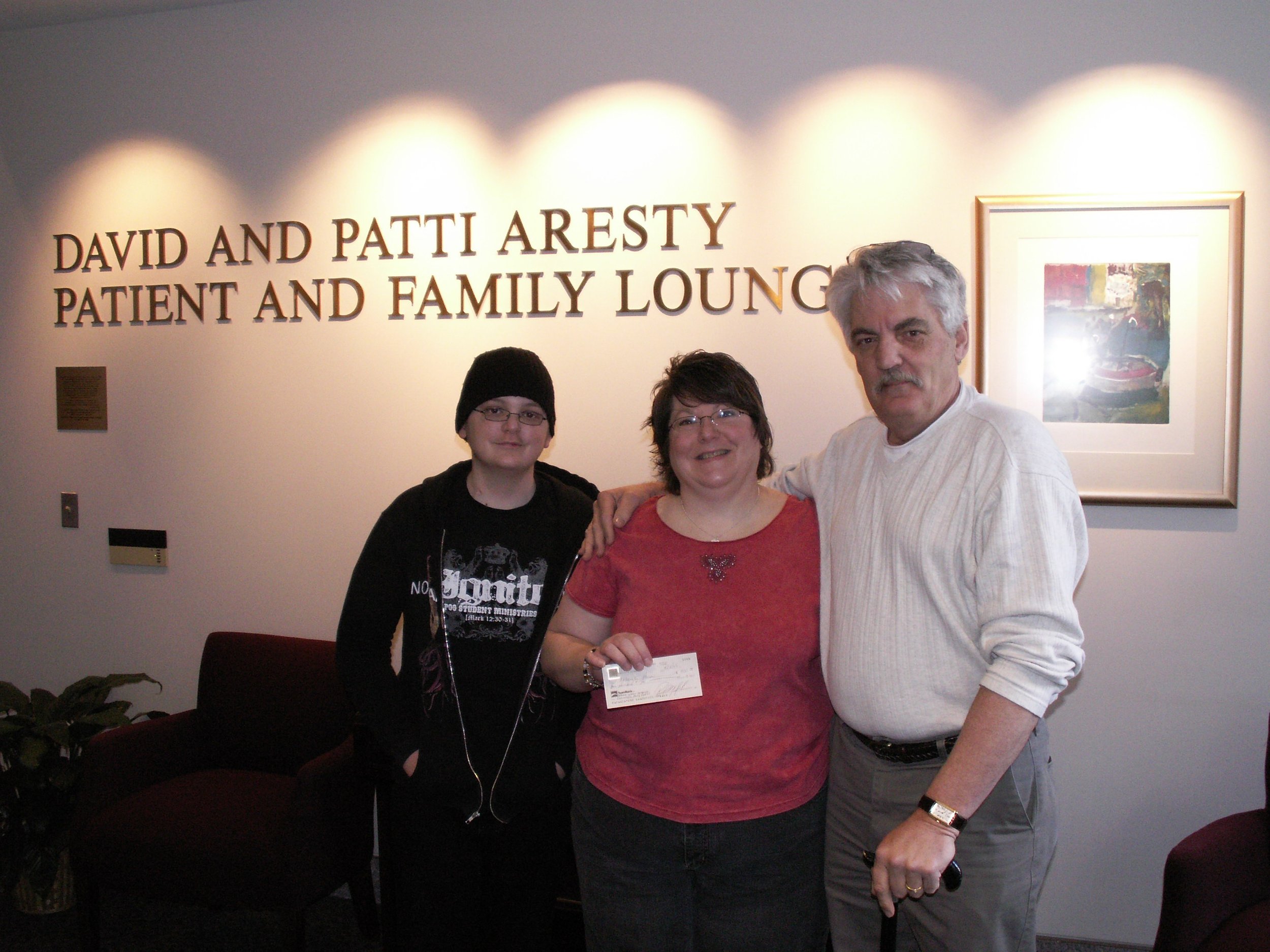  Andy Pickrel with Chuck  presenting them with a check to use for their stay at the transplant center  