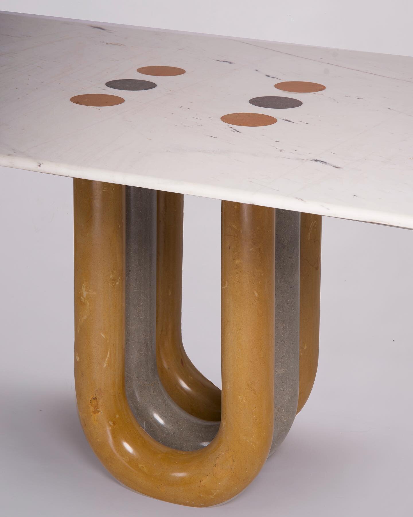 &lrm;عشرين &ndash; Dining table 

While designing this dining table, I played with the concept of perspective. From every angle, a distinct shape unfolds, giving the impression that the table is in motion as we move around it.
Once seated, attention 