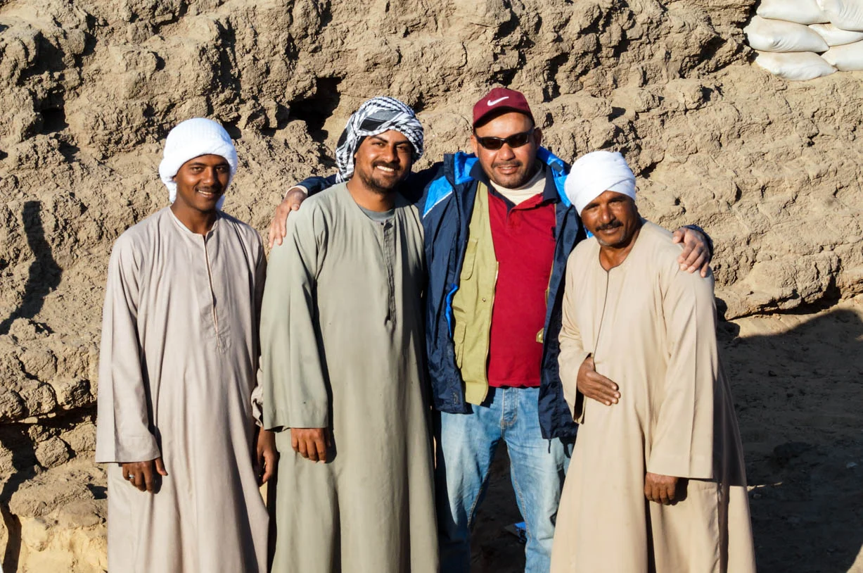 Fig. 20. Archaeologist Mohamed Abul-Yazid (second from right) with archaeological technicians (L-R) ‘Abd al-Rahman al-Daba, Mohamed Kamal ‘Abd al-Hamid, and Waji Hamed ‘Ali of Quft, at the Shunet el-Zebib. Photo: Ayman Damarany / North Abydos Expedition © 2019