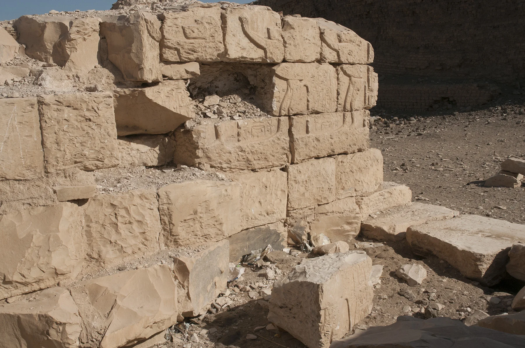 Fig. 12. Detail of a relief block pried out of the northern wall of the central passageway along the temple’s main axis, where it lay discarded by vandals until it could be moved into secure storage in 2018, now awaiting its future restoration to the wall. Photo: Matthew Adams © North Abydos Expedition 2018