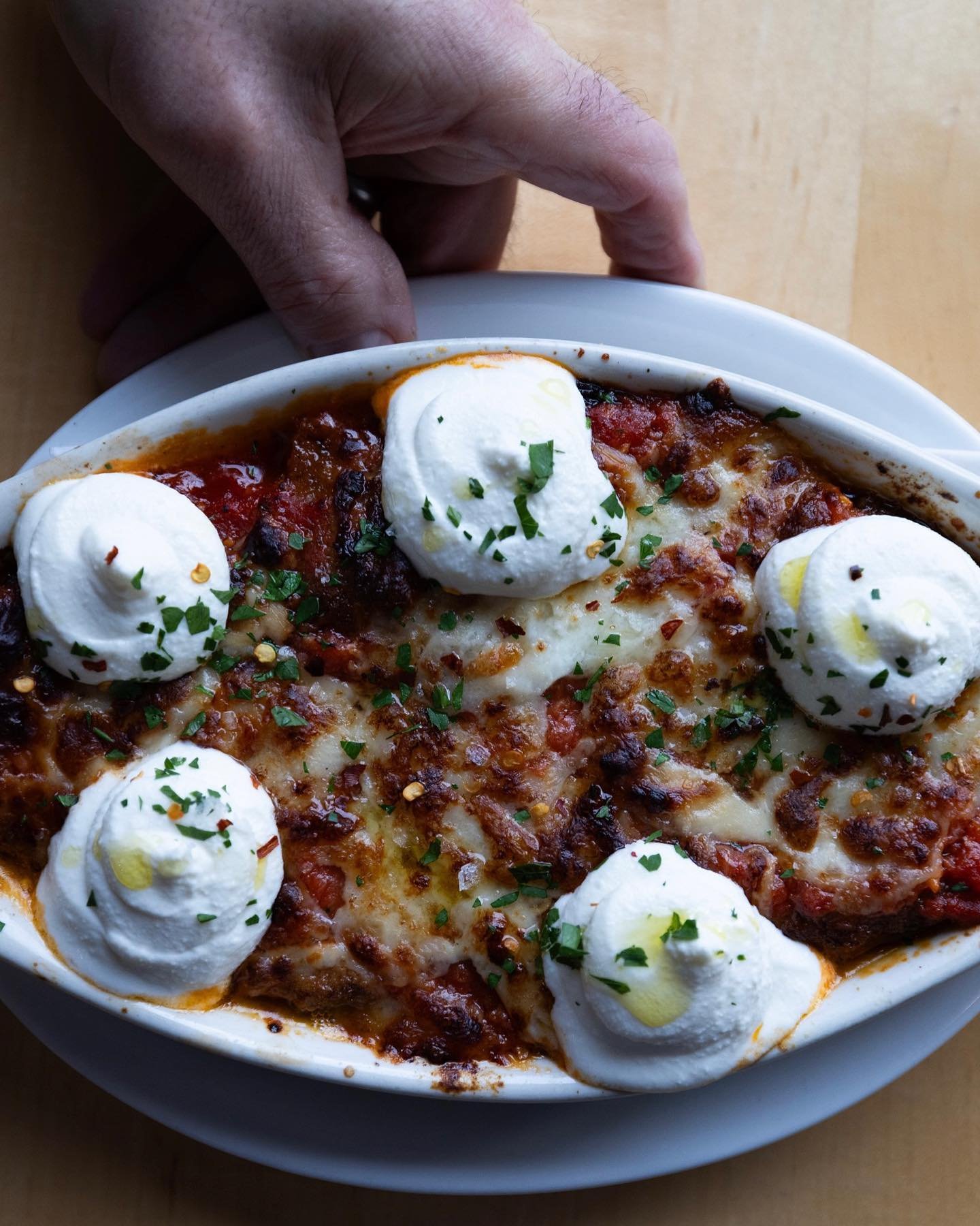 Our no-pasta eggplant parm is about to be replaced (through no fault of her own). Don&rsquo;t miss this one!

Layers of hot crispy golden fried eggplant, mozzarella, tomato sauce, parm, basil, Buffalo mozzarella, topped with whipped ricotta and more 