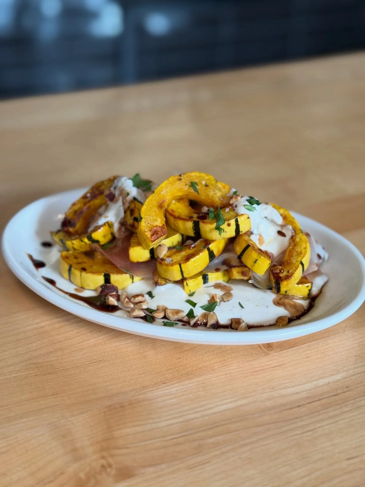 Roasted Delicata Squash &mdash;  smoked prosciutto, 🐽 honey yogurt, and toasted hazelnuts! 🌰 ✨ It&rsquo;s fall on a plate brought to you by the one and only @grassapdx! &hearts;️ 
&bull;
&bull;
&bull;
#pdxnow #pdx101 #pdxeats #pdx #portland #oregon