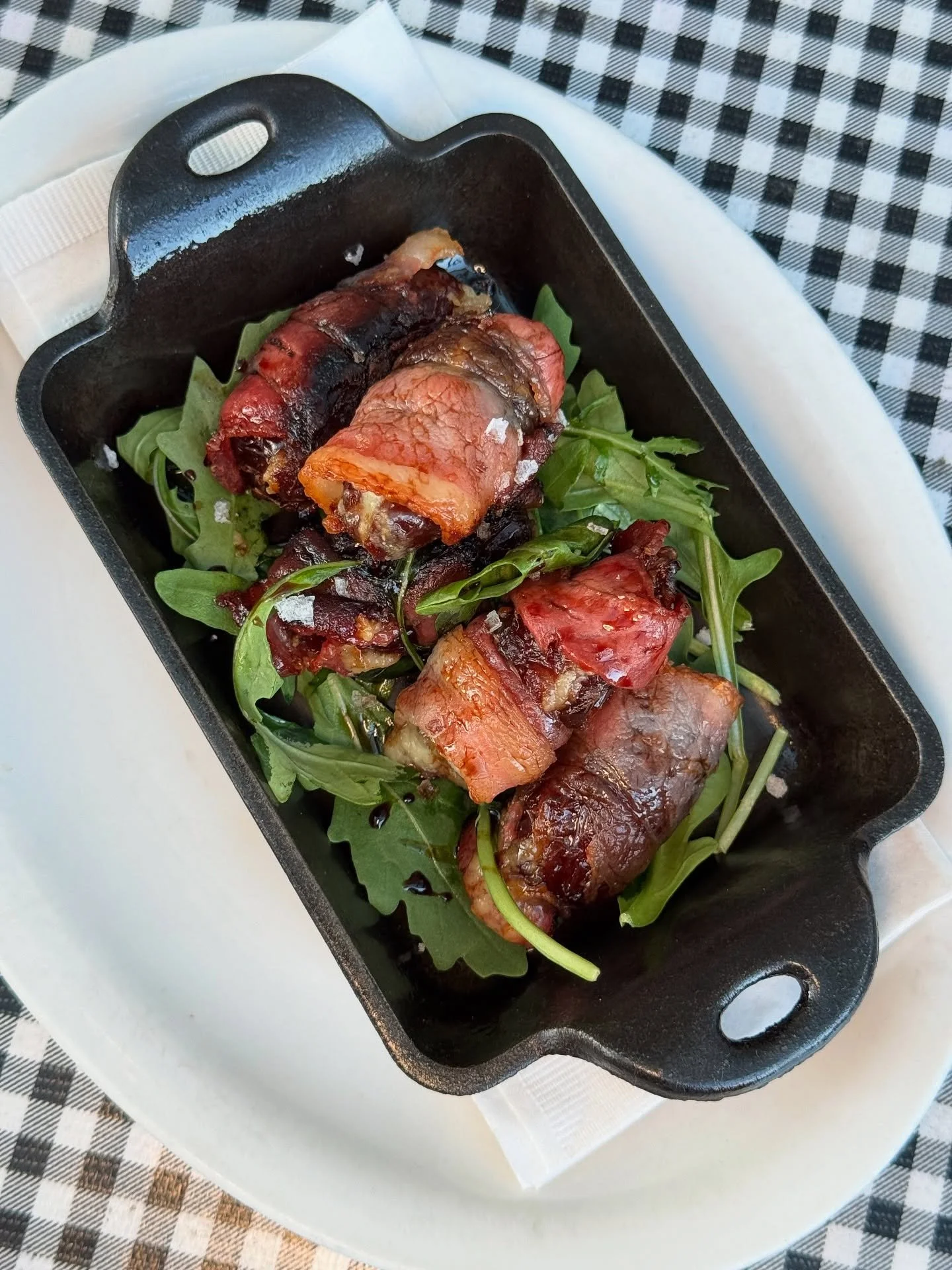 🥓 Meet your new favorite little snack: bacon-wrapped dates filled with rich gorgonzola, almonds, and a glossy drizzle of aged balsamic. It&rsquo;s what weekends are made for. Pair it with our eggnog and call it a day! ✨ 
&bull;
&bull;
&bull;
#pdxnow