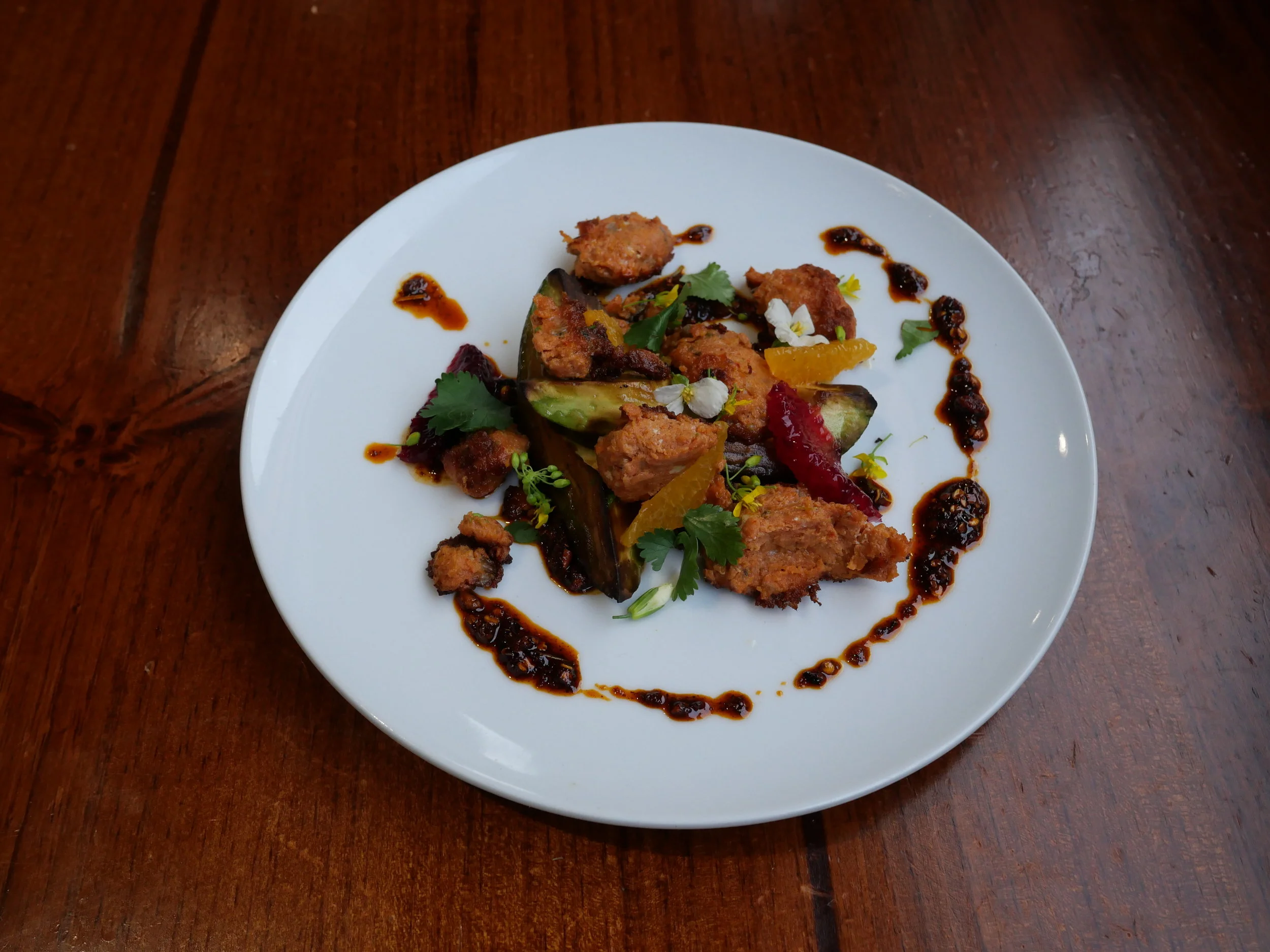 Taku River Sockeye Salmon Chorizo, charred avocado, winter citrus, chili oil