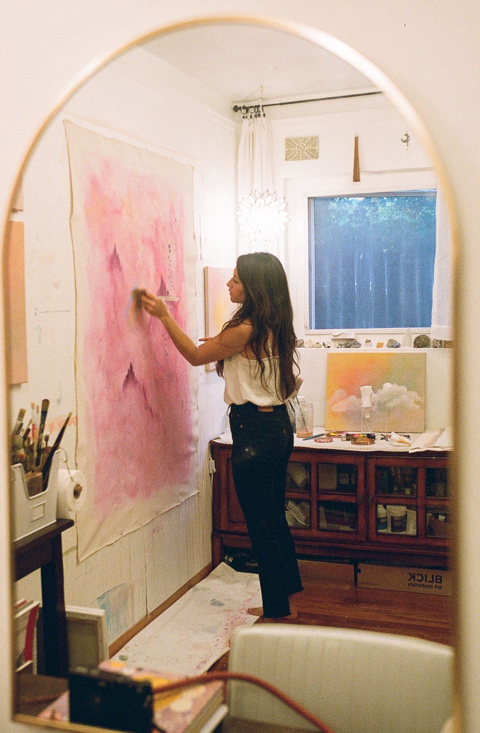 Documentary-style studio photo artist painting