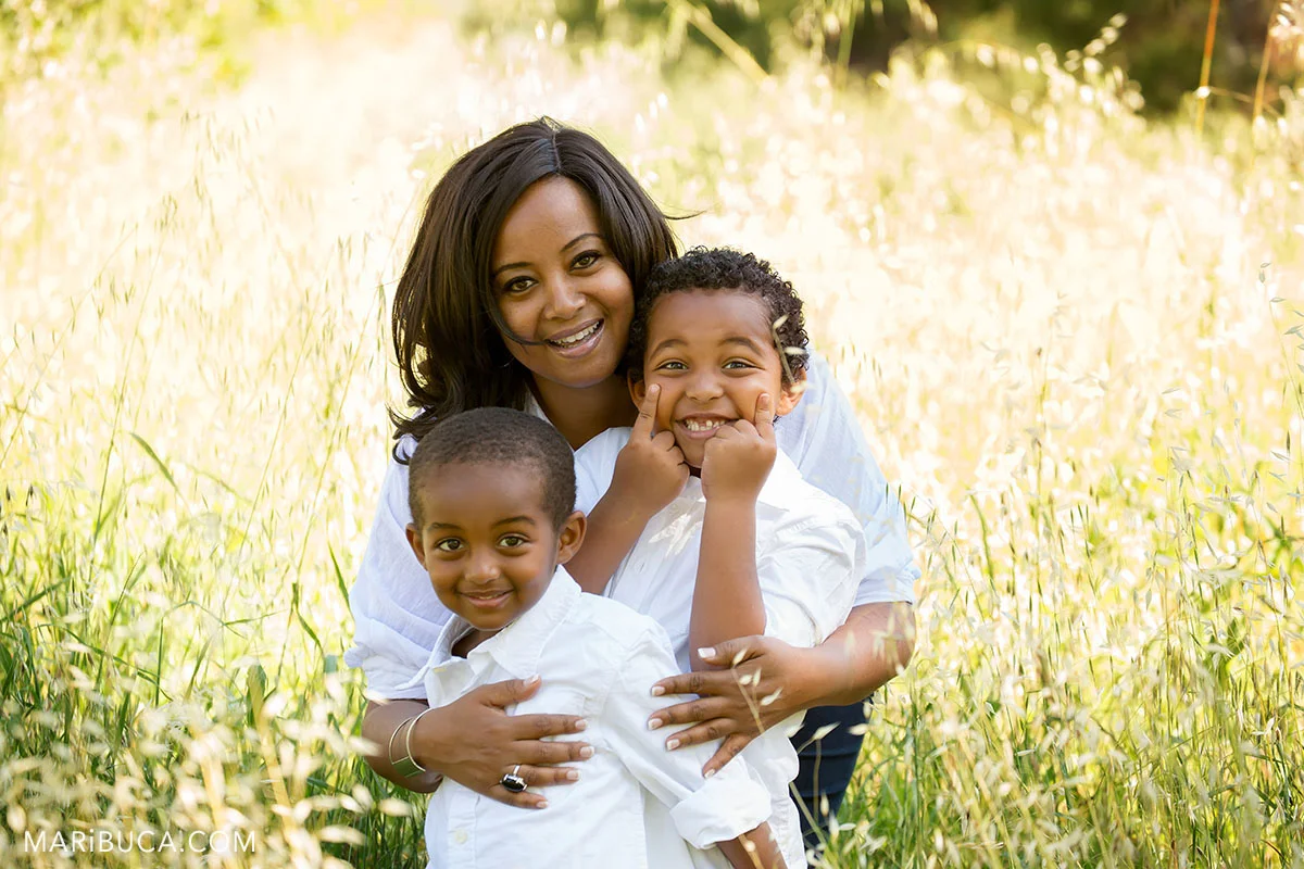 Happy Love Smile and beautiful family mom and two sons in the Baylands park