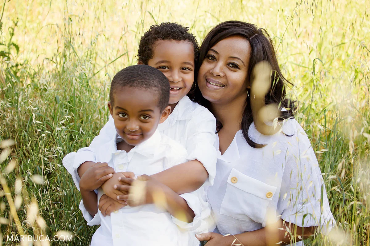 family 2 sons and mom in the park