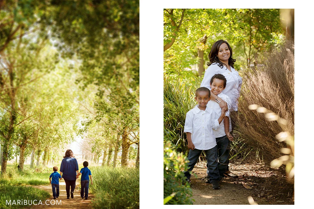 summer time for walking with kids, Mom and her kids walking in the arch trees.
