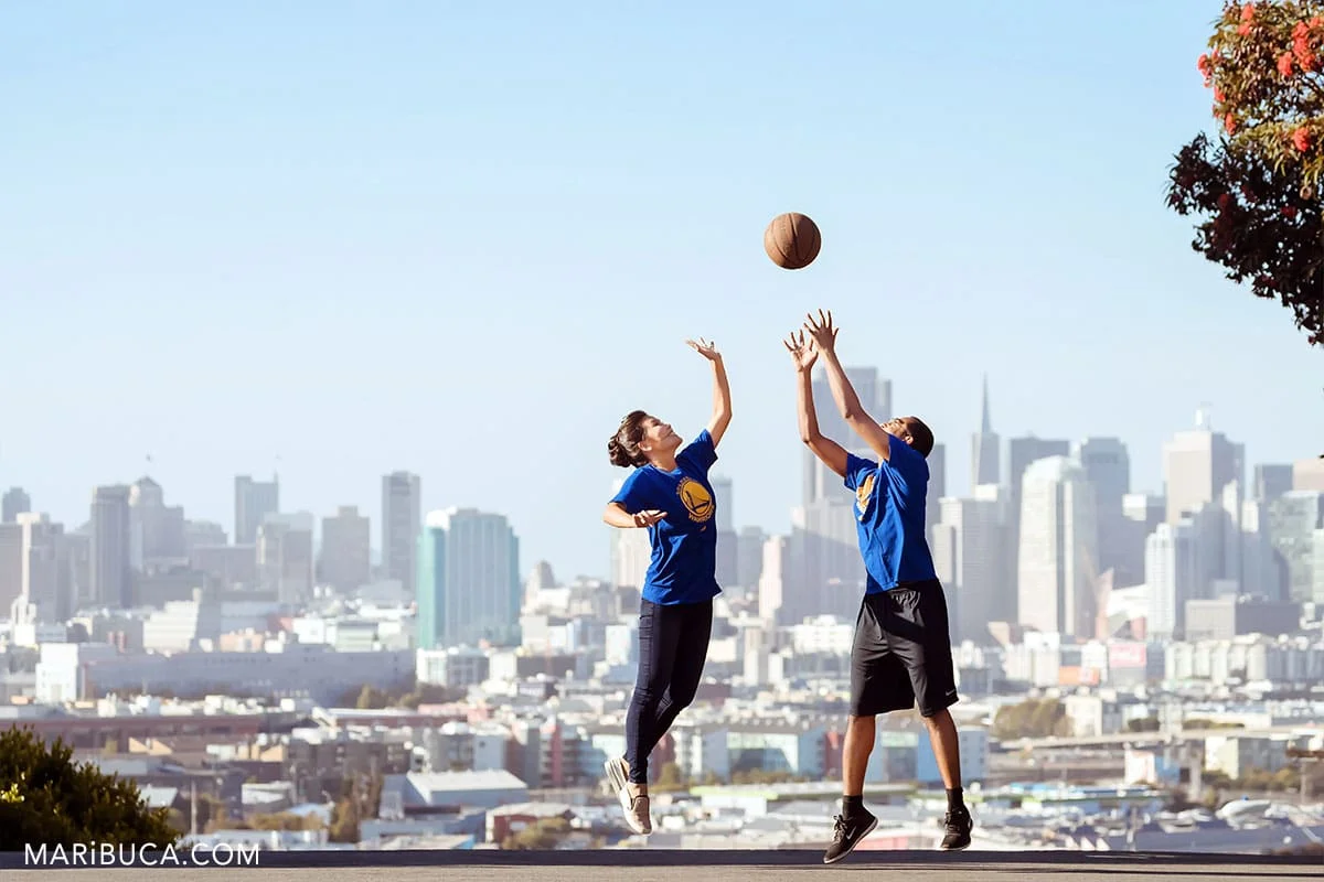 amazing view in the San Francisco with adorable couple playing the basketball