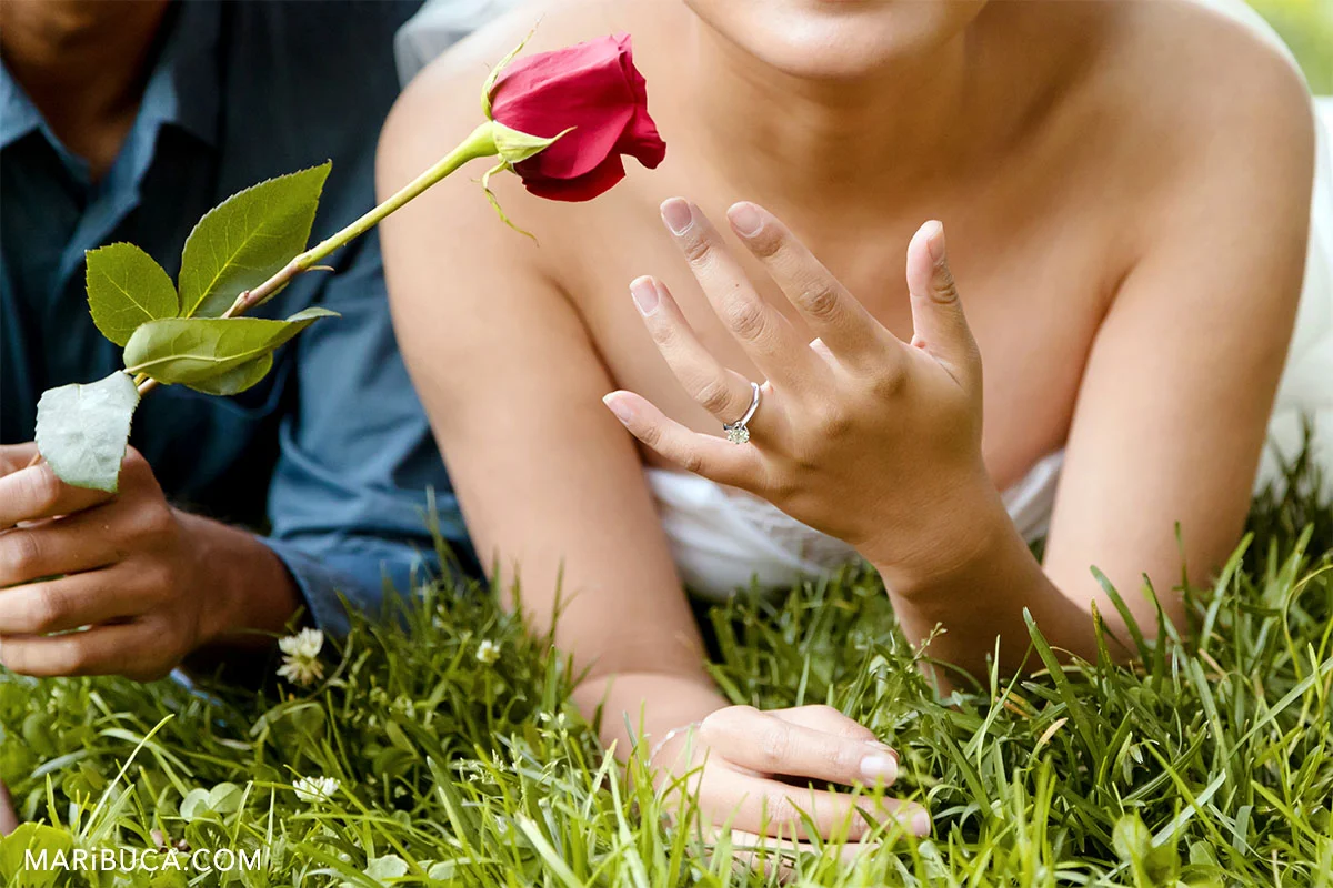 Show me the ring! Red rose as symbol of the love.