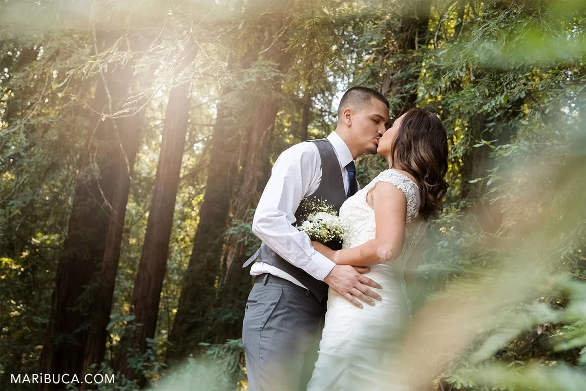Sunset and kissing the bride in the outdoor wedding California.