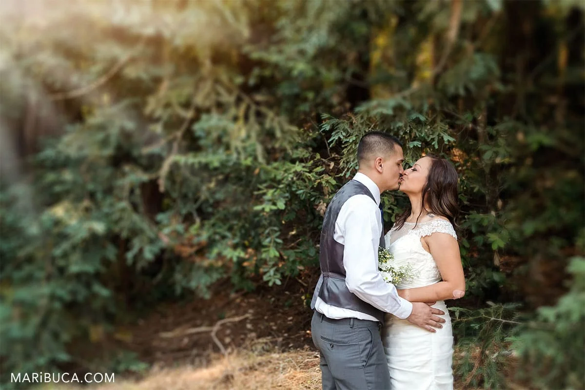Couple without guests kissing each other in the Mt Madonna County Park