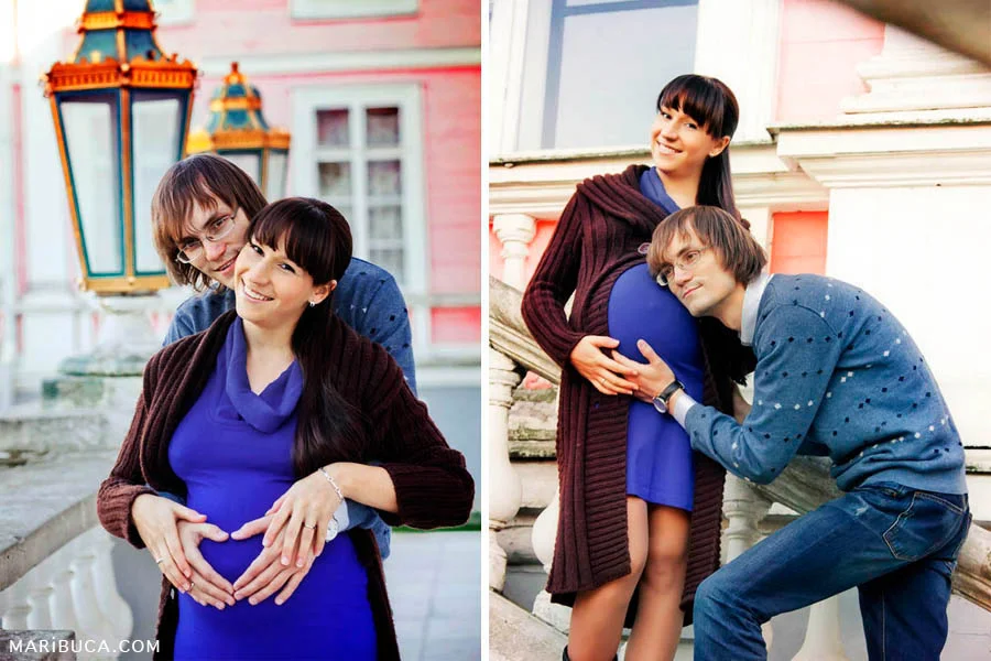 Man and pregnant woman are kept his hands on her abdomen as the heart and laugh.
