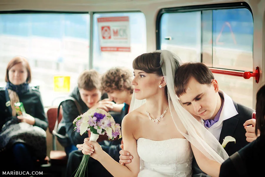 the bride and groom ride public transport on a tram to the registry office in San Francisco.