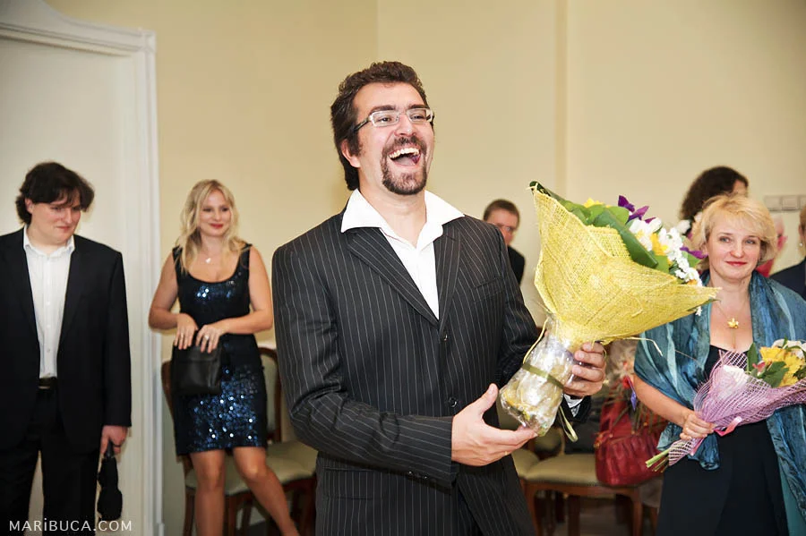 Best man are going to congratulates the bride and groom after wedding ceremony.
