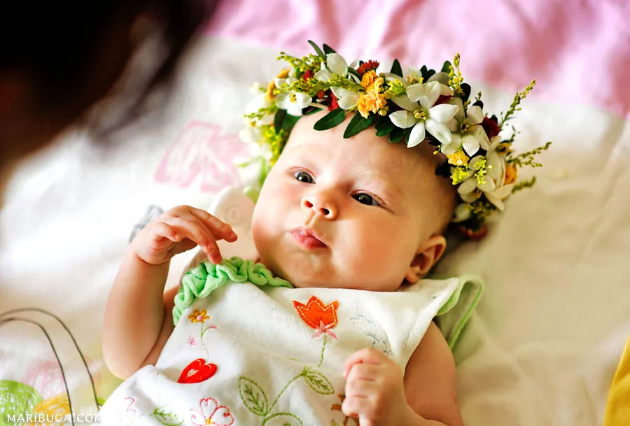 portrait five-month baby girl who listening the mom