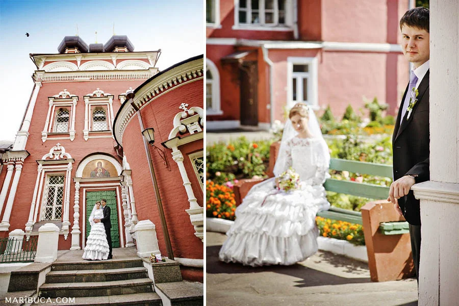 Portrait of newlyweds on the background of a red brick wall of a Christian church.