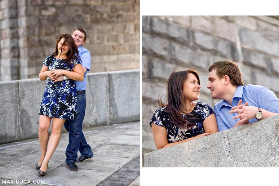 Couple looks each other and fool around in their engagement day