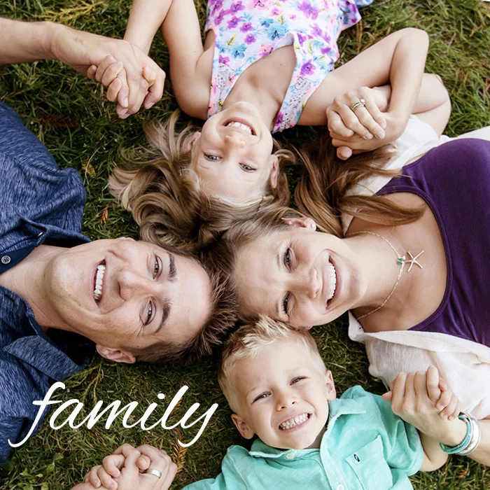 Family-4-lay-down-grass-happy.jpg