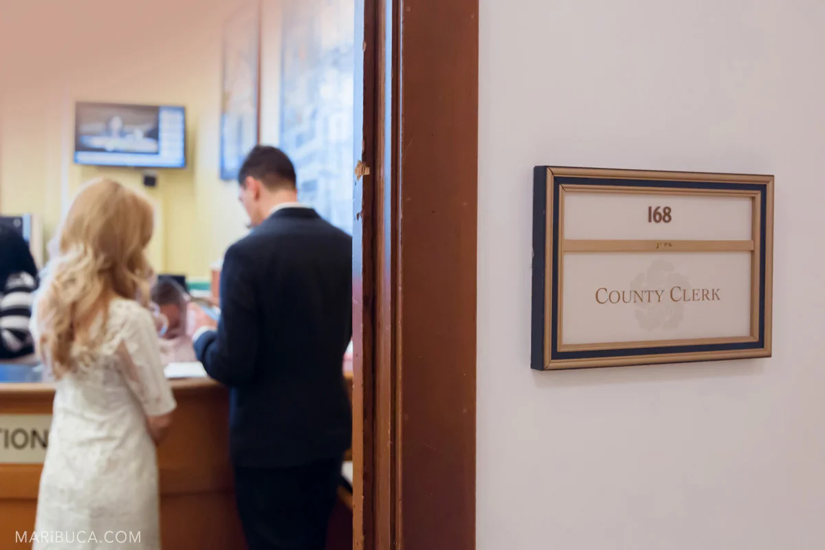 San Francisco City Hall Register office - sign County Clerk, room 168 and the bride and the groom sign documents