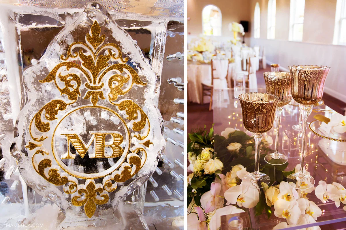 Reception detail decoration: Gorgeous ice bar with golden initial bride and groom sign and golden wine glasses in the table .